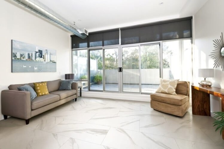 Well Lit Living Room with Porcelain Floor by Urban Construction and Development - Flooring Solutions Burlington