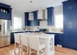 Modern Kitchen with Blue Wooden Cabinets - Kitchen Renovation GTA by Urban Construction and Development